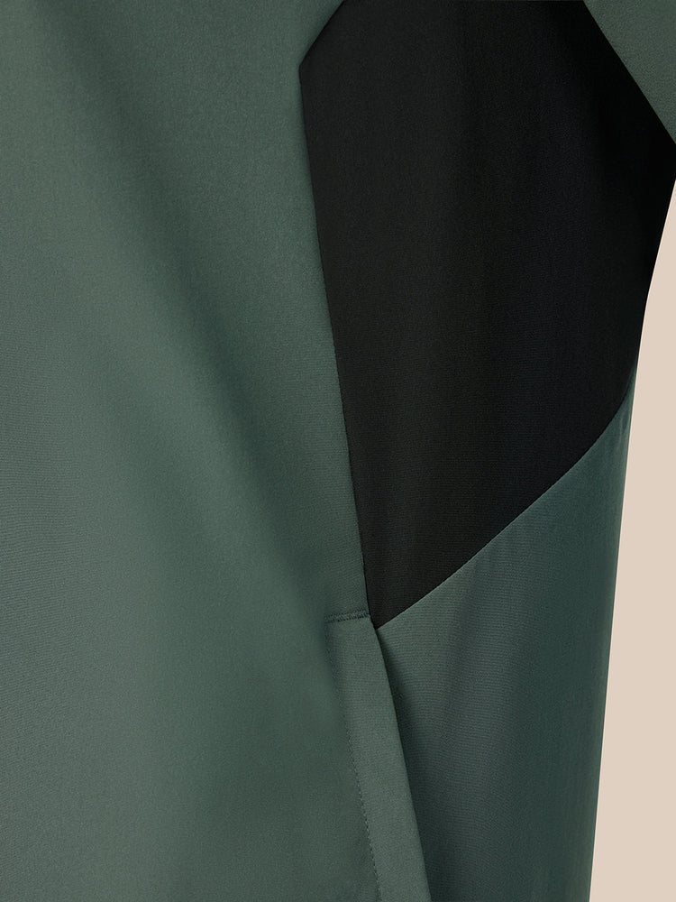 Dark green jacket on a beige background