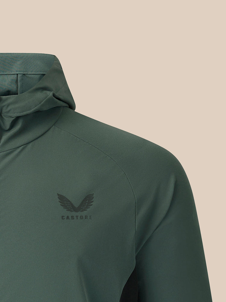 Dark green jacket on a beige background