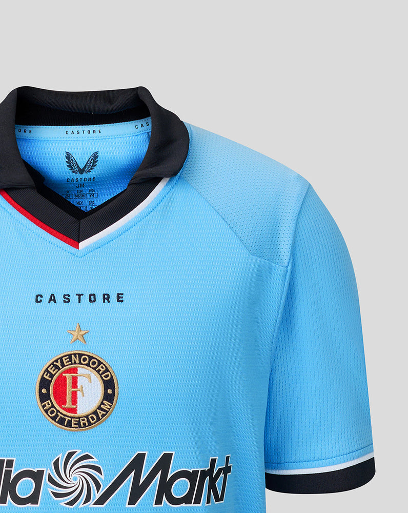Close-up of the chest area on the Feyenoord junior away shirt showing the crest and Castore branding