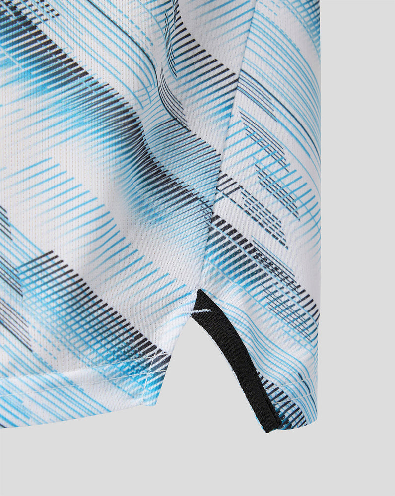 Close up of blue and black abstract pattern on Feyenoord Uit Matchday junior t shirt fabric.