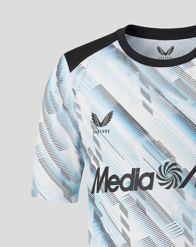 Shoulder and chest close up of the jersey highlighting the crest on the left chest and the blue diagonal pattern