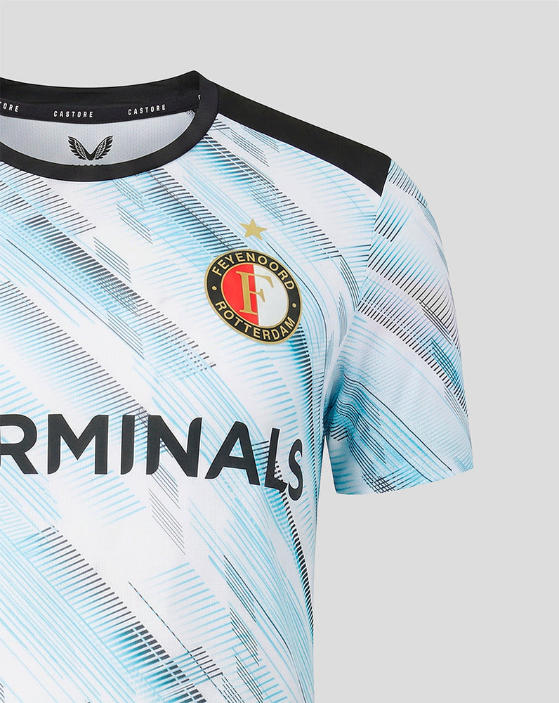 Close-up of the Feyenoord crest on the women's away jersey with a gold star above and a blue abstract pattern across the chest
