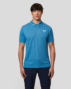 Man in Azure blue Tota Golf Performance Short Sleeve Polo shirt